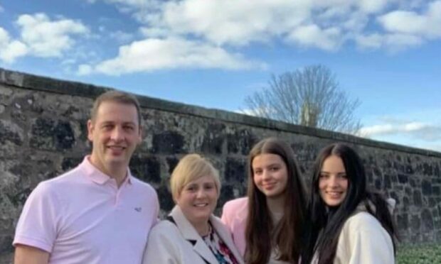 (From left to right) Dad Stuart with wife Julia and daughters Laura, 17, and Emma.