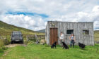 Lucy Holt, Gayle Ritchie and three Labradors at the 'hut of dreams' on Straloch Estate.