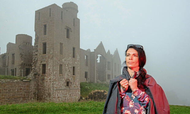 A red mist descends on Gayle Ritchie as she visits Slains Castle, a major inspiration for Bram Stoker when he wrote Dracula. Picture: Scott Baxter.