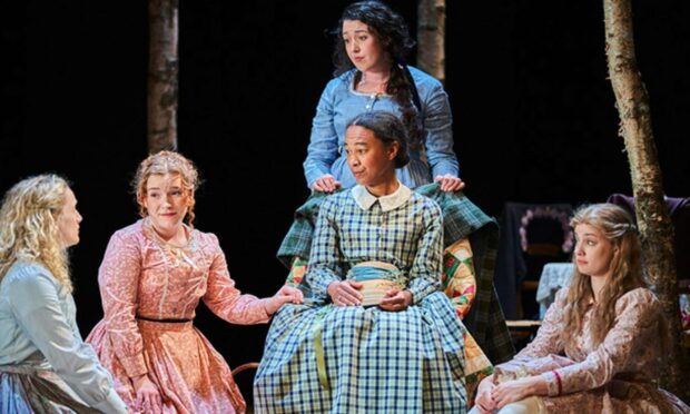 Amelia Donkor as Marmee in a scene with the March sisters in Pitlochry Festival Theatre's Little Women.
