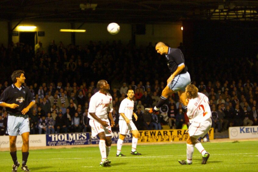 Lee Wilkie towers above the Perugia defence to power in Dundee's equaliser.