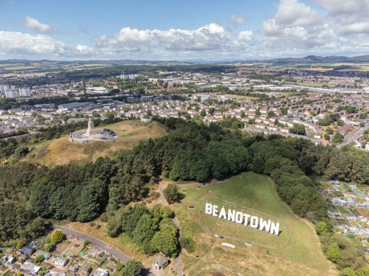 aerial view of Dundee with Hollywood-style Beanotown sign on the Law.