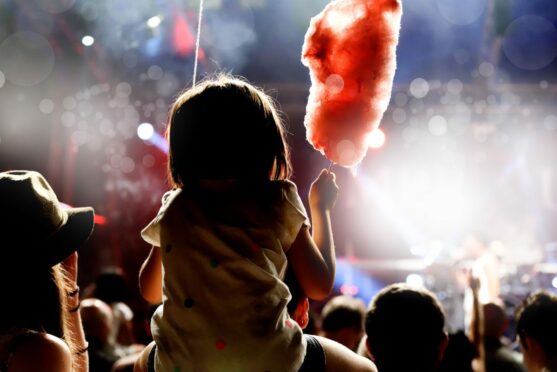 child at a music festival for families