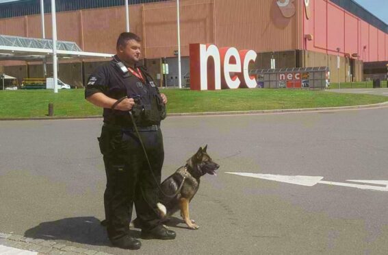 team from Wright's K9 Security Services in front of NEC Birmingham