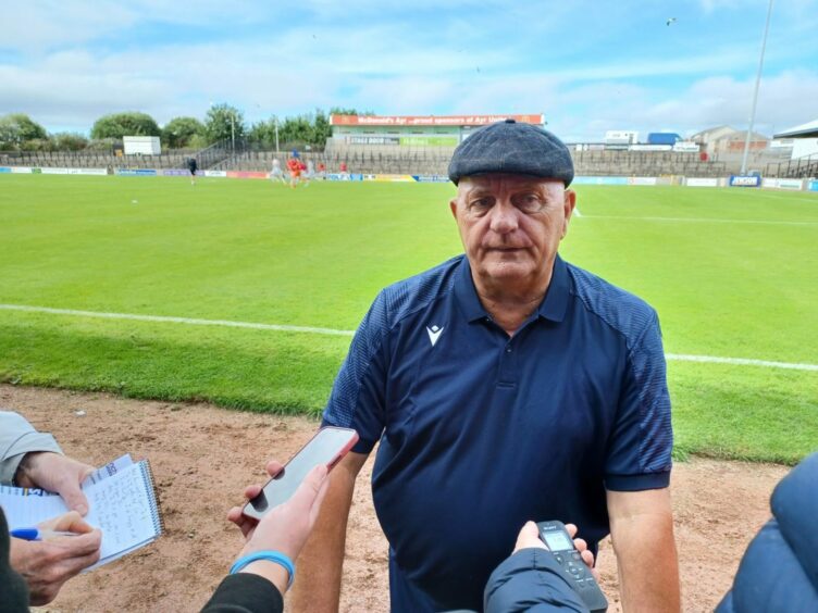 Dick Campbell speaks to the press at full-time.