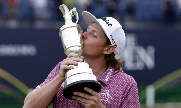 Australia's Cameron Smith celebrates with the Claret Jug after winning The Open at the Old Course, St Andrews. Image: PA