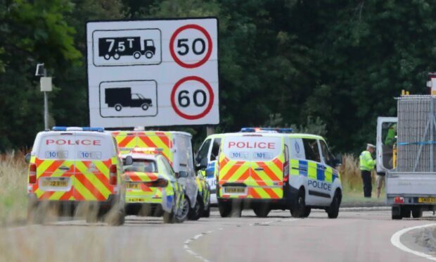 Police at the scene of the fatal collision on the A90 near Invergowrie.