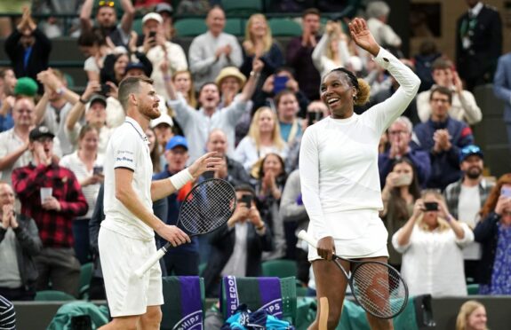 Jamie Murray and Venus Williams celebrate victory in their mixed doubles match against Alicja Rosolska and Michael Venus.