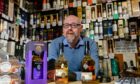 Whisky shop owner Andrew Cuthbert has lost his alcohol licences.