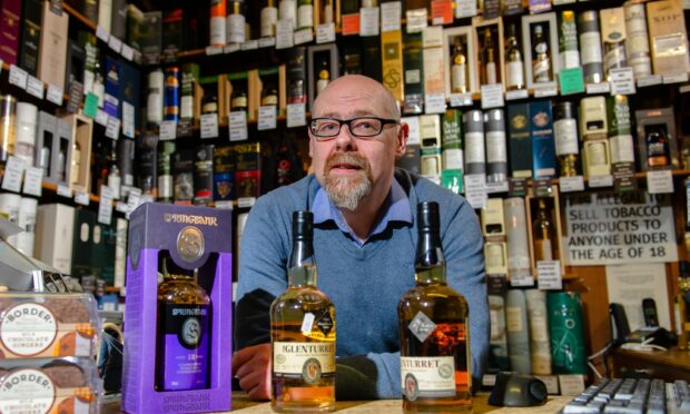 Whisky shop owner Andrew Cuthbert has lost his alcohol licences.