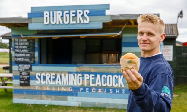 Guy Wade outside the Screaming Peacock street food van.