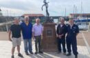 Dale Smith (third from left) fulfilled his father's dying wish by unveiling a memorial plaque at Arbroath harbour in 2022. Image: Supplied