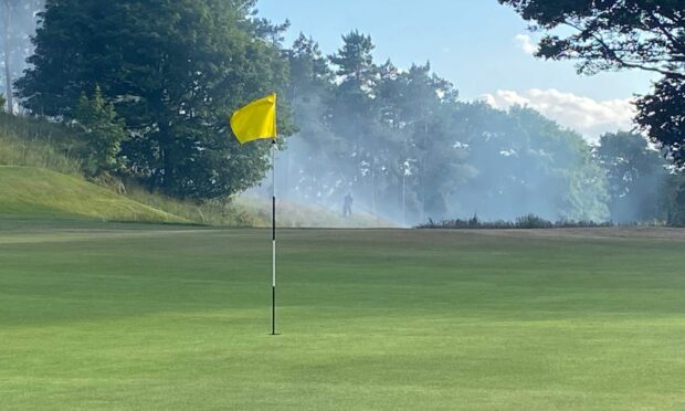Smoke at Glenrothes Golf Club as fire fighters battle with a fire near the course.