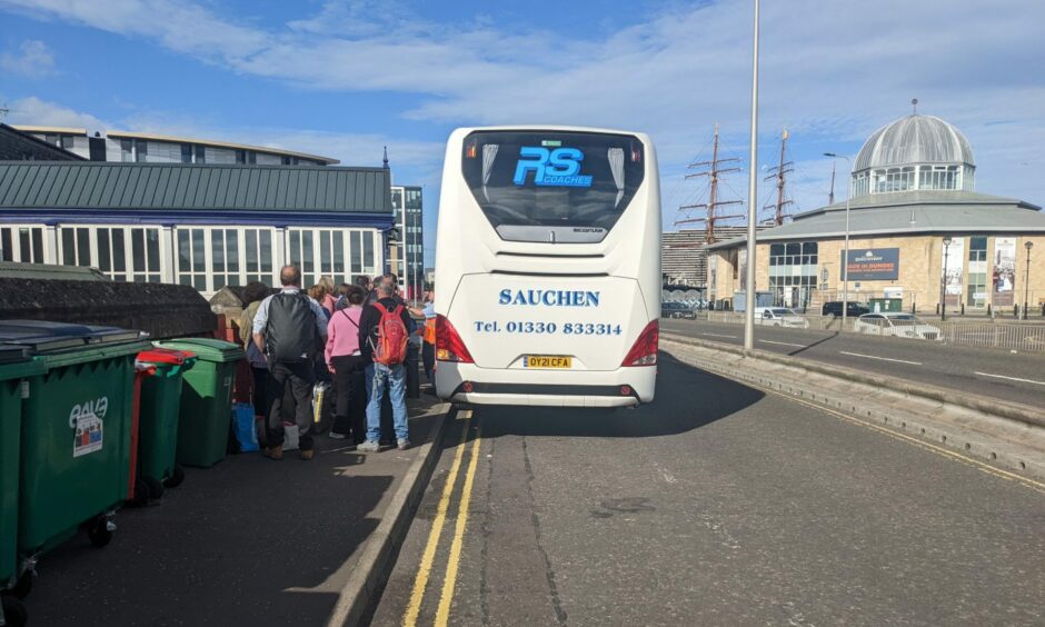 Passengers at Dundee train station boarding a replacement bus.