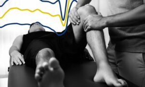 A man receiving physiotherapy on his legs with a line chart in the background to symbolise nhs physio waiting times in scotland
