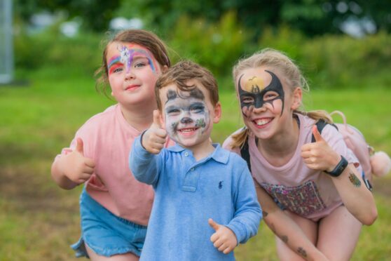 Scottish Game Fair 2022 at Scone Palace Grounds in Perth. From left to right is Daisy Roe (aged 6) and brother Murray Roe (aged 3) and their cousin Violet Tasker (aged 9) all from Kirkcaldy. All pictures by Steve MacDougall / DC Thomson