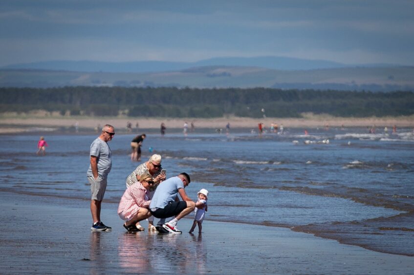 Visitors at St Andrews beach.