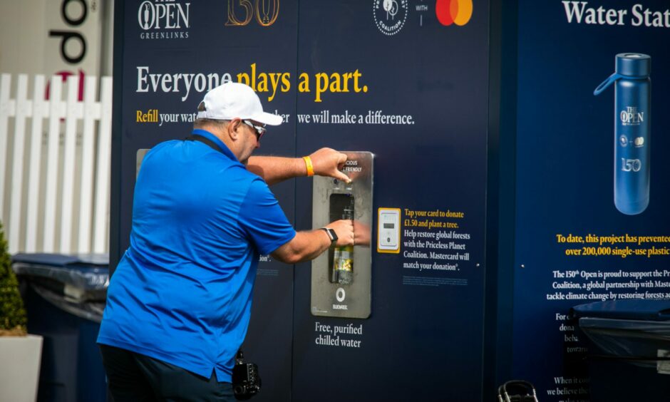 Filling up a water bottle at The Open Championship on the Old Course