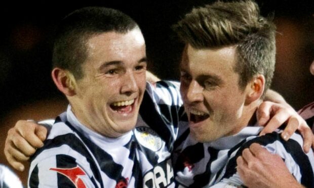 Graham Carey celebrates with John McGinn.