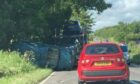 A car has fallen off the back of a transporter near Cluny in Fife. Pic Fife Jammer Locations.