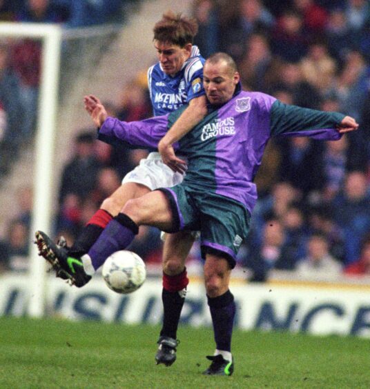 George O'Boyle in the last teal and magenta kit.