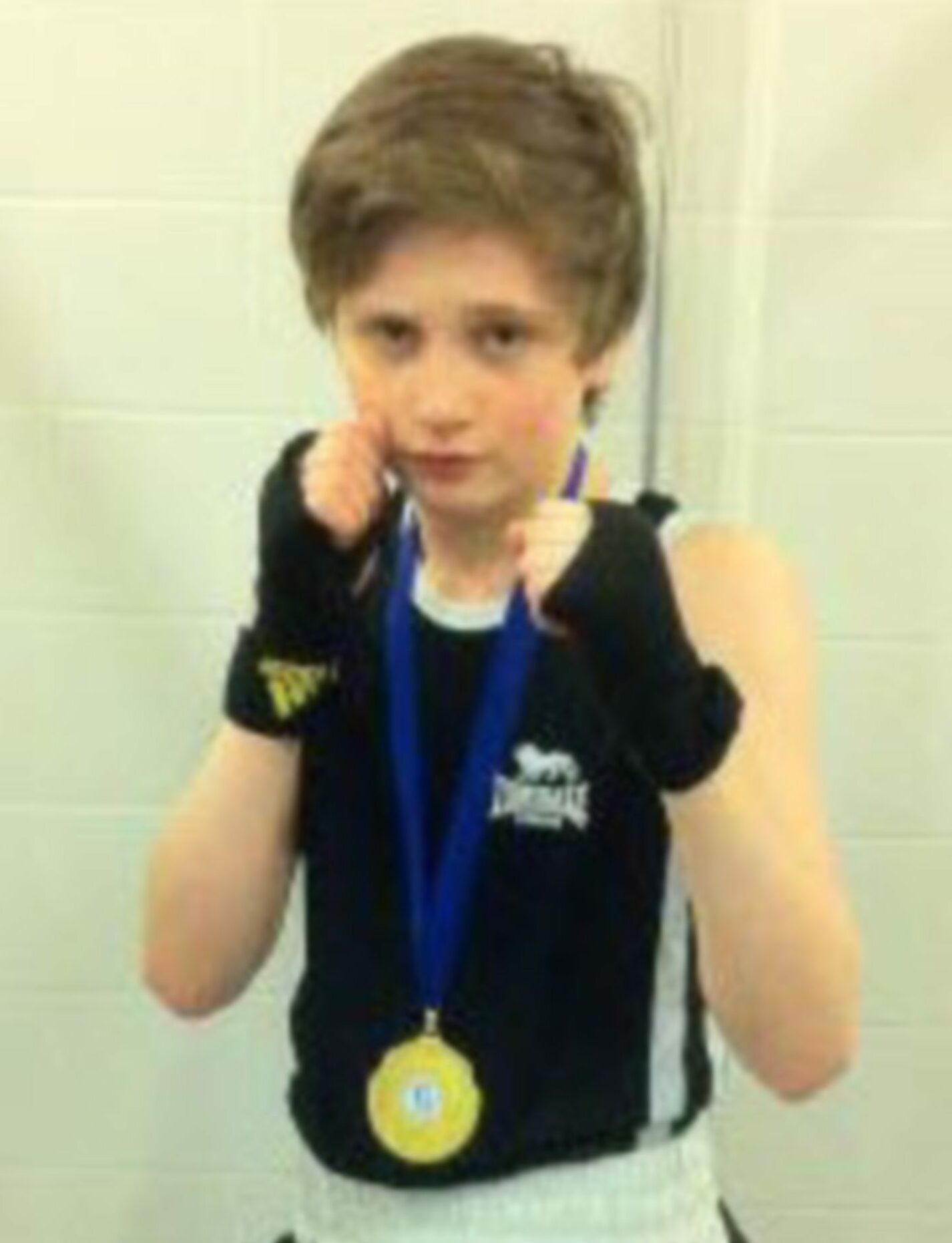 A young Sam Hickey after winning gold in his weight class at the Intermediate Scottish Championships in 2013.