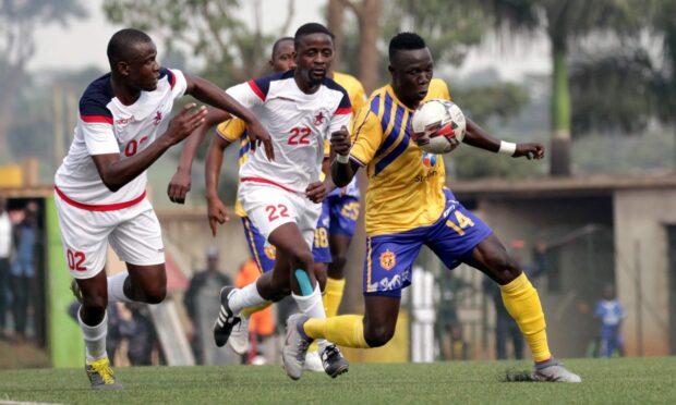 Sadat Anaku of KCCA FC, right, controls the ball on his chest