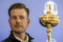 Henrik Stenson looks at the Ryder Cup Trophy during a press conference in Rome earlier this year.