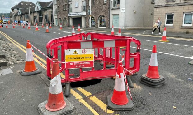 A sinkhole has opened up on a busy Perth street.