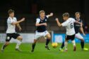 Dundee's Max Anderson takes on Ayr United at Somerset Park.