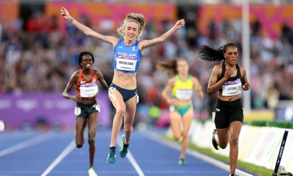 Eilish McColgan of Scotland celebrates victory in the 10,000m final ahead of Kenya's Irene Cheptai.