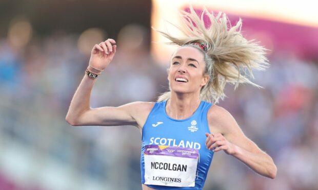 Eilish McColgan crosses the line.