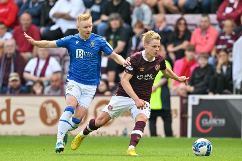 Ali Crawford tackles Gary Mackay-Steven.