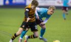 Lucas Williamson, here in action against Hearts' Gary Mackay-Steven, was knocked unconscious.