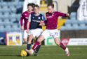 Max Anderson of Dundee and Arbroath's Scott Stewart tussle during the sides' last meeting in 2021.