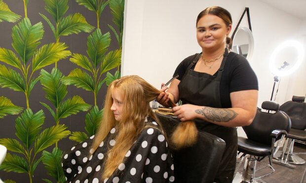 CR0037505

  Teased Hair
 Dunsinane Avenue, Dundee

Teased Hair salon inundated after offering free back to school haircuts for low income families and those struggling with rising cost of living.

Pic shows Salon owner Zoe Cochrane cutting 9 year old Lexie Byrne's hair
....Pic Paul Reid