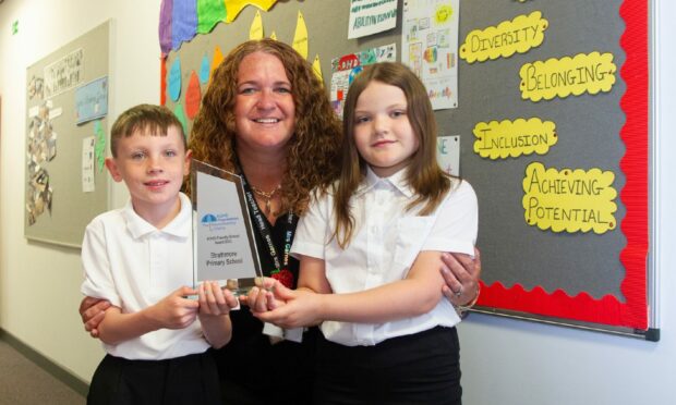 Strathmore Primary School head teacher Jennifer Garnes with pupils Brayden (left) and Sidney. Pictures by Paul Reid.