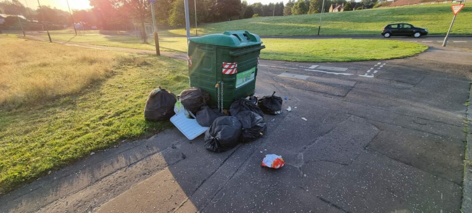 A recycling point at Helmsdale Avenue in Kirkton with several bags of rubbish left dumped on Thursday morning.