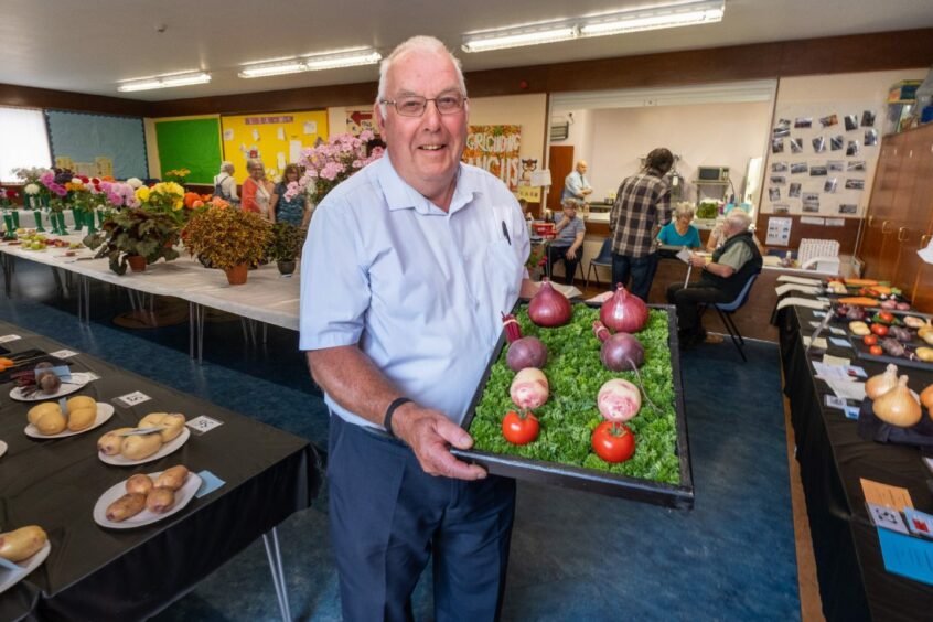 Dave Robbie with his award-winning tray of vegetables.
