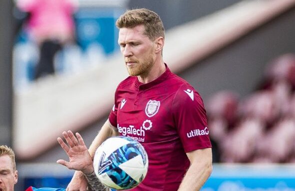 Colin Hamilton fouled in the box, leading to Ayr's opener. Image: SNS