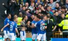 Stevie May celebrates with his St Johnstone team-mates in front of their fans as he scores a last minute winner.