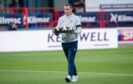 Dundee manager Gary Bowyer lays a wreath in memory of Dundee legend Pat Liney.