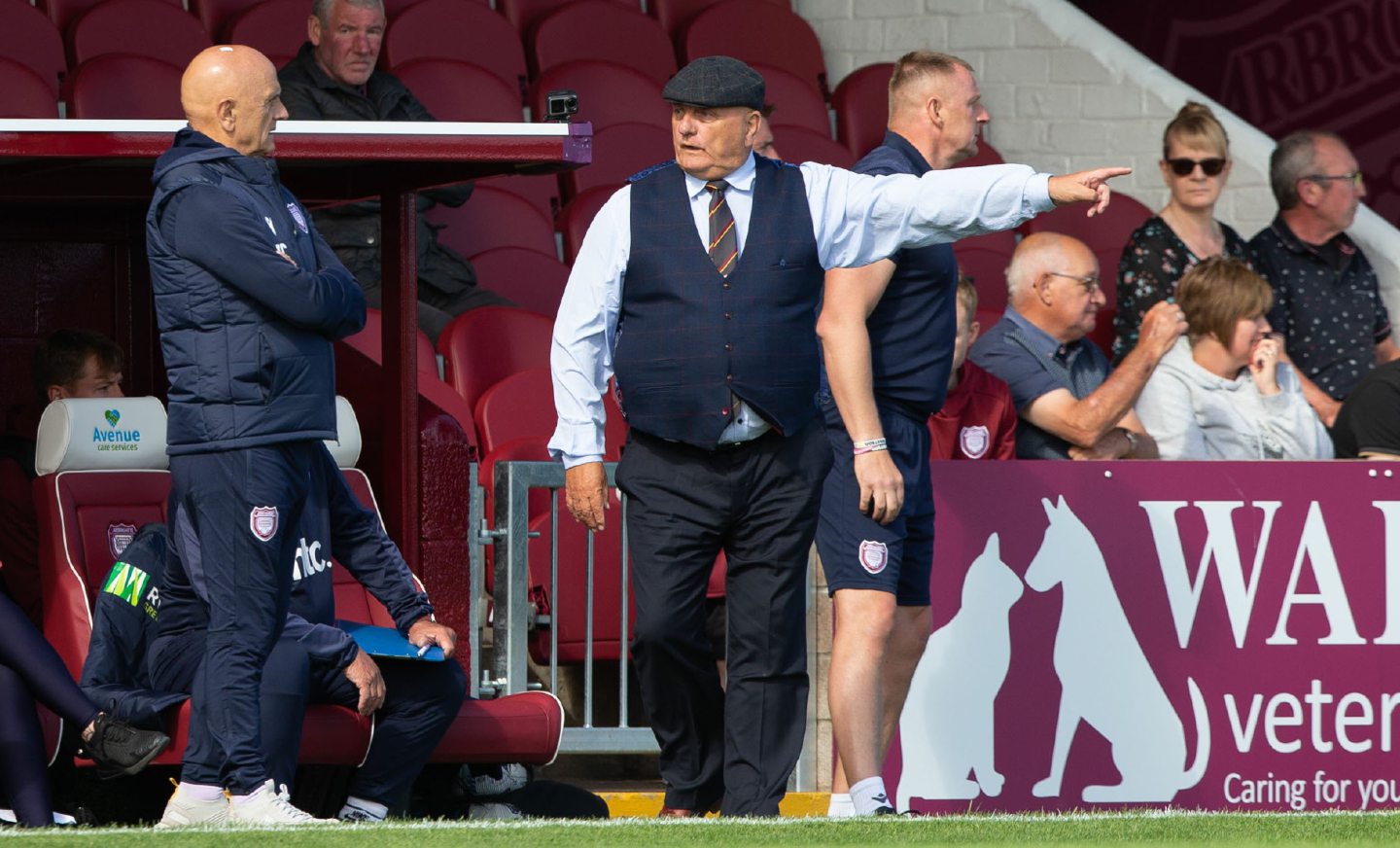 Dick and Ian Campbell discuss tactics on the sideline.