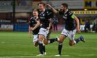 Lee Ashcroft celebrates his goalscoring return to Dundee's starting XI.