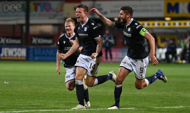 Lee Ashcroft celebrates his goalscoring return to Dundee's starting XI.