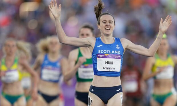 Laura Muir celebrates after winning gold.