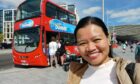 Writer Billy Jane boarding open top bus tour.