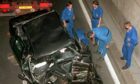 French investigators at the scene of the car crash that killed Princess Diana.