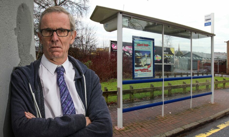 Councillor Fraser Macpherson in front of a bus shelter.