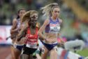 Eilish McColgan leads eventual winner Yasemin Can (in red vest) in the European Championships 10,000m final
